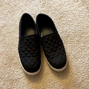 Quilted black slip ons